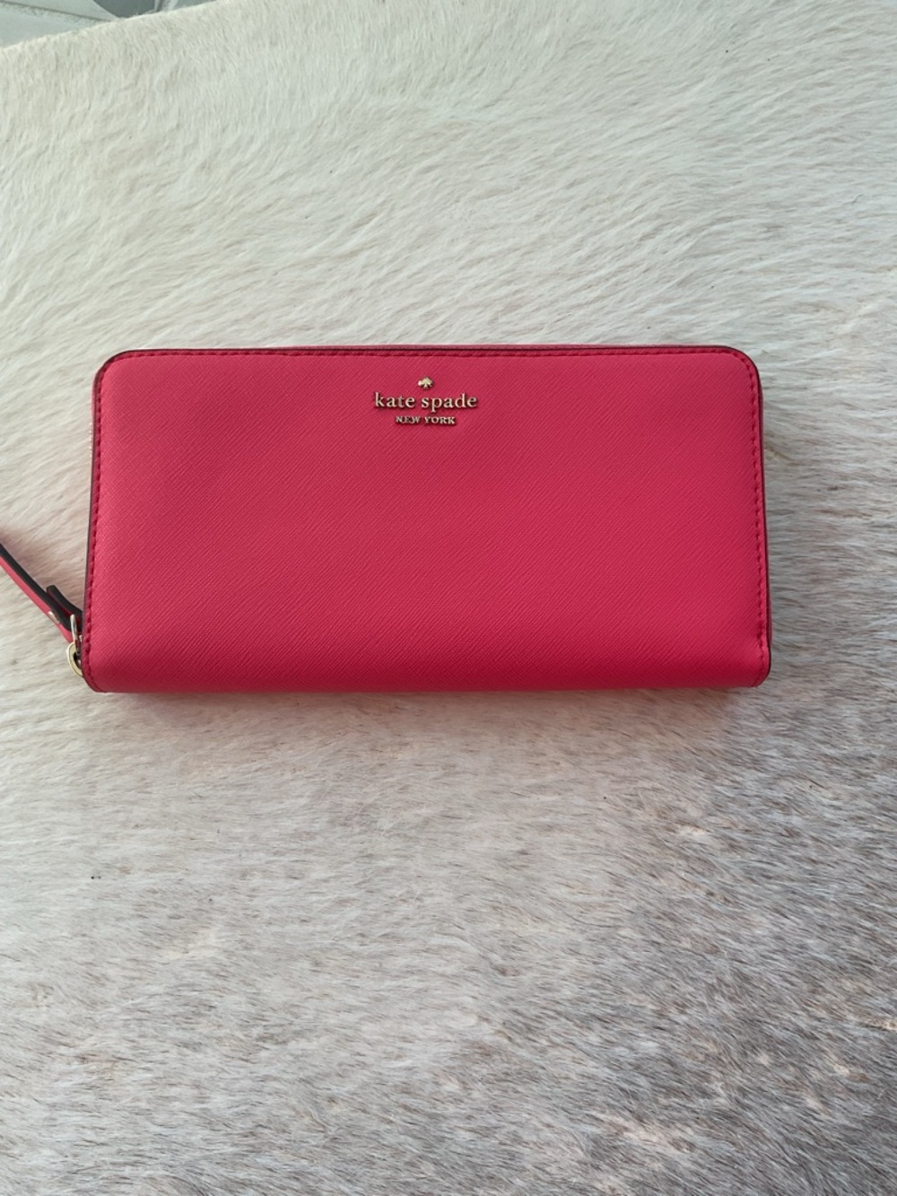 kate spade pink zip-around saffiano wallet with gold logo